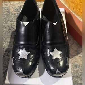 Stefan Cookee Black Leather Slip-On Loafers with Silver Star Appliqué